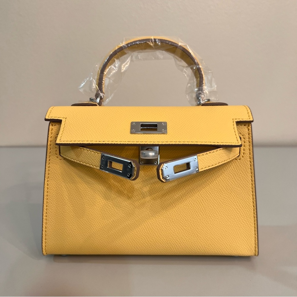 Genuine Epsom Leather mini handbag with shoulder strap featuring Silver hardware